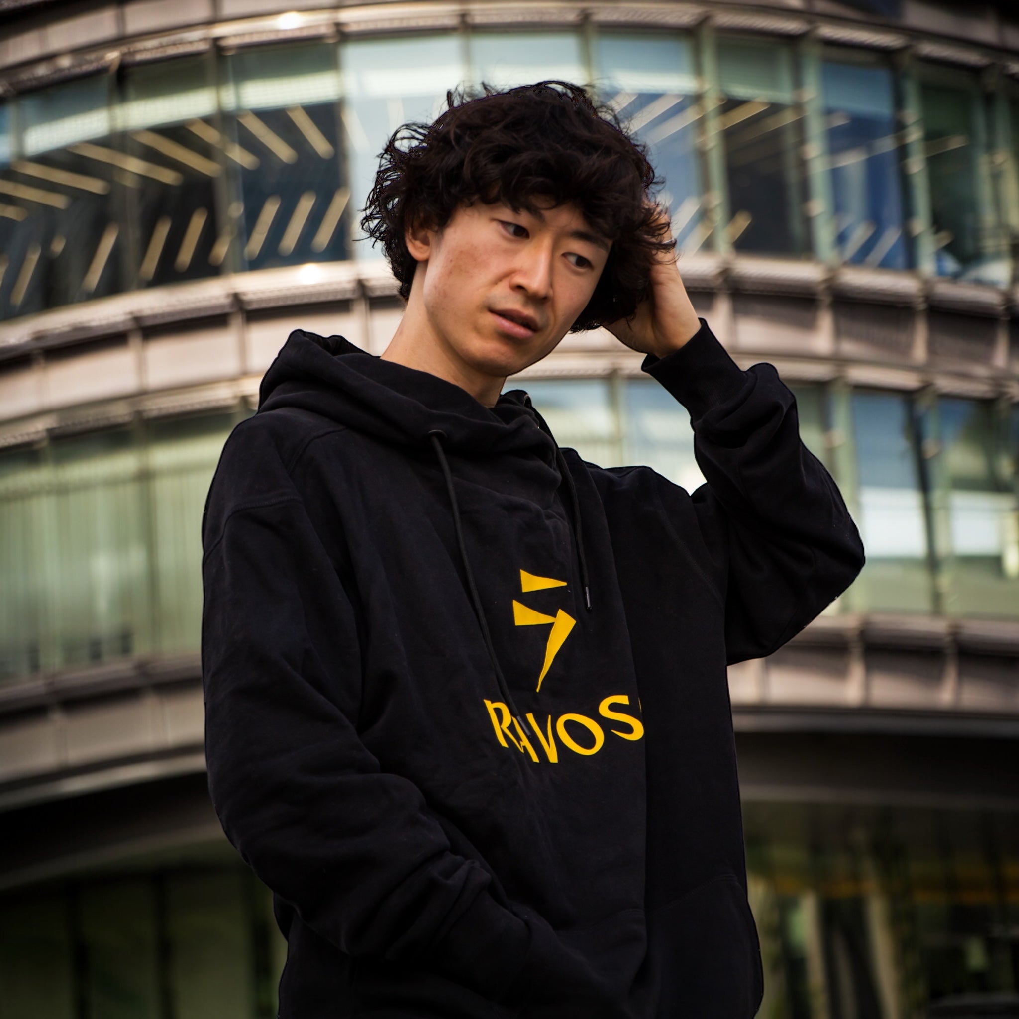A RAVOSO hoodie worn on the street in Tokyo